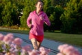 Woman running in autumn park, beautiful girl runner jogging outdoors Royalty Free Stock Photo