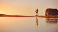 Woman running on the beach Royalty Free Stock Photo