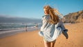 Woman running beach and smiling for camera Royalty Free Stock Photo