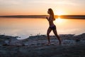 Woman Running on the Beach at Sunset Royalty Free Stock Photo