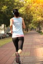 Woman running at city park Royalty Free Stock Photo