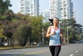 Woman running at city street Royalty Free Stock Photo