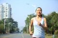 Woman running at city street Royalty Free Stock Photo