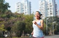 Woman running at city street Royalty Free Stock Photo