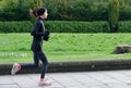 Glasgow, UK, March 17th 2024, Woman running in the countryside for health and wellbeing