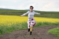 Woman running on a countryside road. Freedom concept Royalty Free Stock Photo