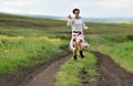 Woman running on a countryside road. Freedom concept Royalty Free Stock Photo