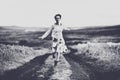 Woman running on a countryside road Royalty Free Stock Photo