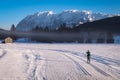 Woman running cross-country skiing with nice view to mountain Grimming Royalty Free Stock Photo