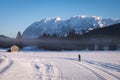 Woman running cross-country skiing with nice view to mountain Grimming Royalty Free Stock Photo