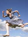 Woman Running in Dress Royalty Free Stock Photo