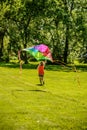 Woman Running and Flying Colorful Kite Royalty Free Stock Photo
