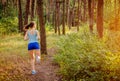 Woman running in the forest Royalty Free Stock Photo