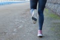 Woman running legs in road. Athletic, active Royalty Free Stock Photo