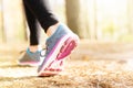 Woman running legs in sunset forest Royalty Free Stock Photo