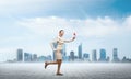 Woman running outdoor with vintage red phone Royalty Free Stock Photo