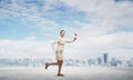 Woman running outdoor with vintage red phone Royalty Free Stock Photo
