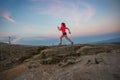 Woman running on rocks. Female cross country running in mountains. Royalty Free Stock Photo