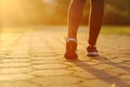 Woman and running shoes, exercising in the park.