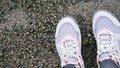 Woman running shoes on street top view Royalty Free Stock Photo