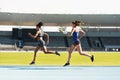 Woman, running and stadium track in competition, race or fitness for athletics in the outdoors. Fit, active or sporty Royalty Free Stock Photo