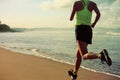 Woman running on sunrise sandy beach