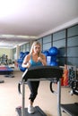 Woman running on treadmill Royalty Free Stock Photo
