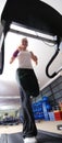 Woman running on treadmill Royalty Free Stock Photo