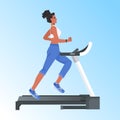 Woman running on treadmill african american girl doing fitness exercises training healthy lifestyle concept Royalty Free Stock Photo