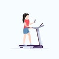 Woman running on treadmill girl using smartphone while training workout gym digital gadget addiction concept flat full Royalty Free Stock Photo