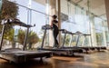 Woman running on treadmill in gym. Ealthy lifestyle