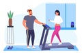 Woman running on treadmill with personal fitness couch Royalty Free Stock Photo