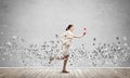 Woman running with vintage red phone Royalty Free Stock Photo