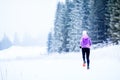 Woman running in winter, fitness inspiration and motivation Royalty Free Stock Photo