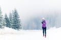 Woman running on winter trail, fitness inspiration and motivation Royalty Free Stock Photo