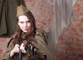 Woman in Russian military uniform shoots a rifle. Female soldier during the second world war. Royalty Free Stock Photo