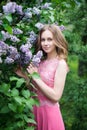 Woman, russian model in blossom spring lilac park