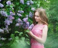 Woman, russian model in blossom spring lilac park