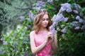Woman, russian model in spring blossom lilac park