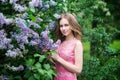 Woman, russian model in blossom spring lilac park