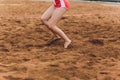 Woman`s Backside Holding a Soccer Ball Soviet red shorts. Royalty Free Stock Photo