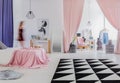 Woman`s bedroom with pink curtains Royalty Free Stock Photo