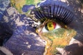 Woman`s face with planet Earth texture and belgian flag inside the eye. Royalty Free Stock Photo