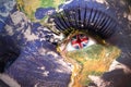 Woman`s face with planet Earth texture and british flag inside the eye. Royalty Free Stock Photo