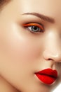 Woman`s face with vivid make-up and colorful nail polish Royalty Free Stock Photo