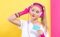 Woman in 1980`s fashion holding a cassette tape