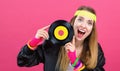 Woman in 1980`s fashion holding a record Royalty Free Stock Photo