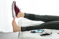 Woman`s feet up on bed in home. Concept Relaxation after running