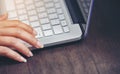 A woman finger is pressing the enter key on her keyboard. Royalty Free Stock Photo