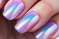 Woman\'s fingernails with pastel colored nail polish